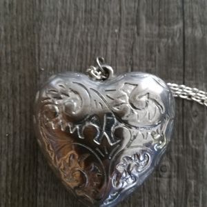 Oversized heart. Silvertone. 2"heart with 15" chain. $16.00